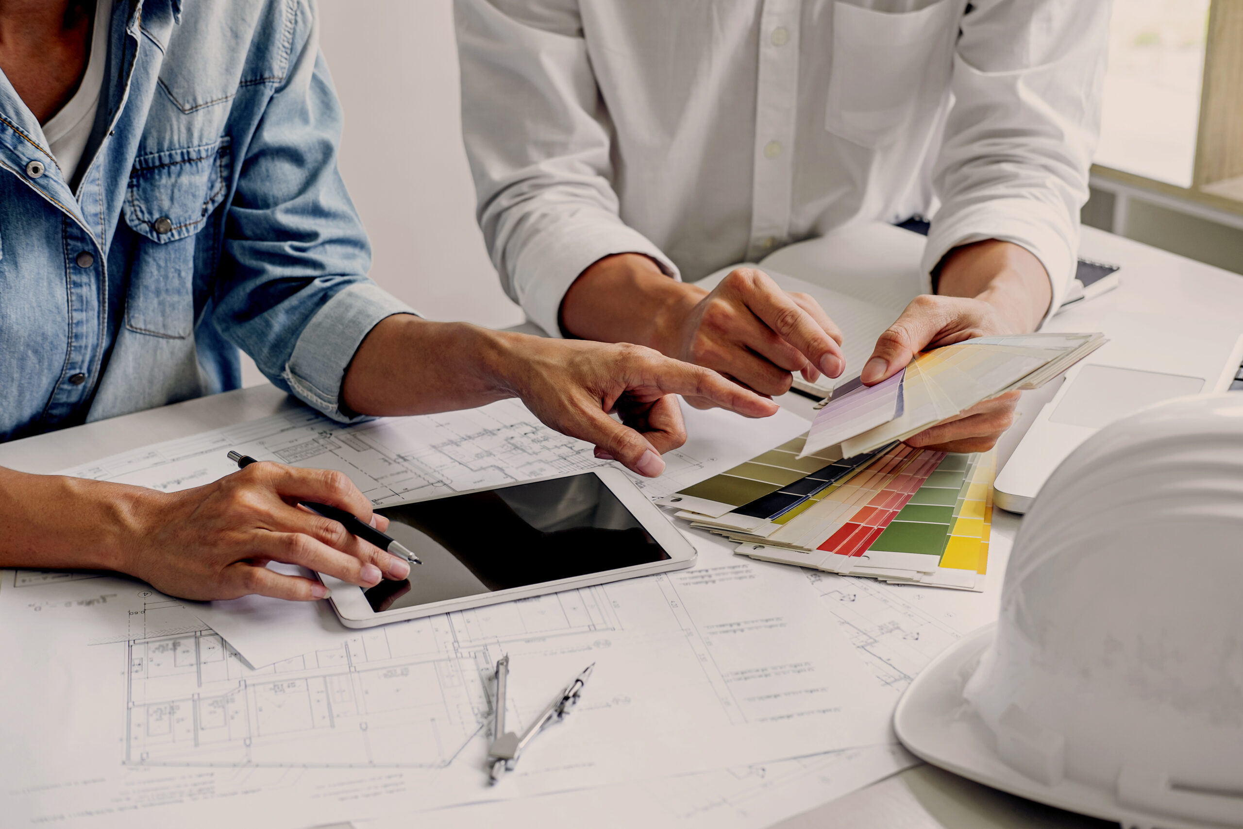 Construction and structure concept of Engineer or architect teamwork meeting for project working with partner and engineering tools on model building and blueprint in working site.